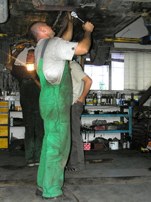 M & M Automotive of Rhinebeck, LTD. Mechanic hard at work on another satisfied customer customers vehicle.